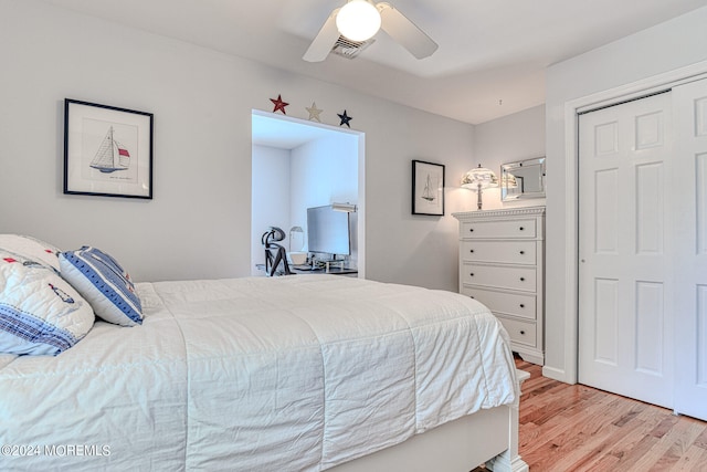 bedroom featuring light wood-type flooring, ceiling fan, and visible vents