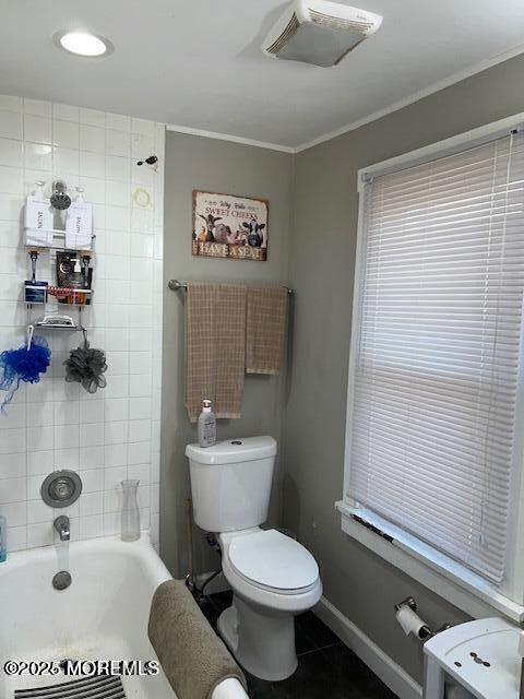 full bathroom featuring ornamental molding, baseboards, visible vents, and toilet