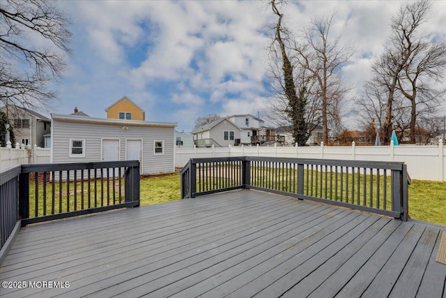 deck featuring a fenced backyard and a yard