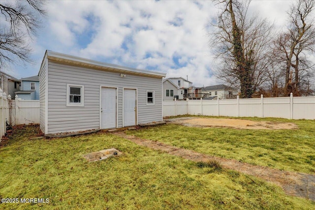 view of yard featuring an outbuilding and a fenced backyard