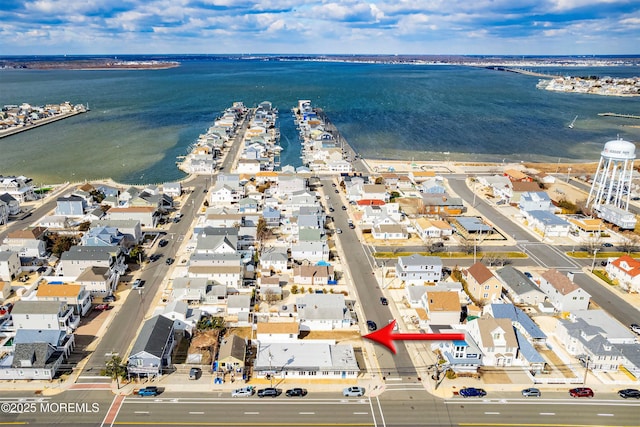 bird's eye view with a water view and a residential view