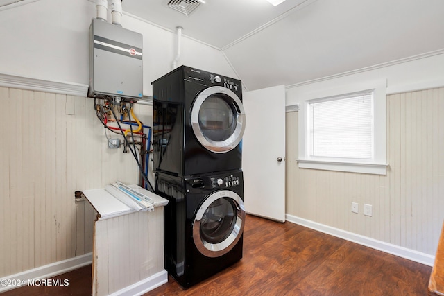 clothes washing area featuring laundry area, visible vents, stacked washer and clothes dryer, wood finished floors, and water heater