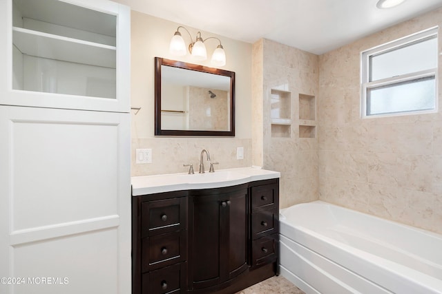 bathroom with  shower combination, vanity, and tile walls