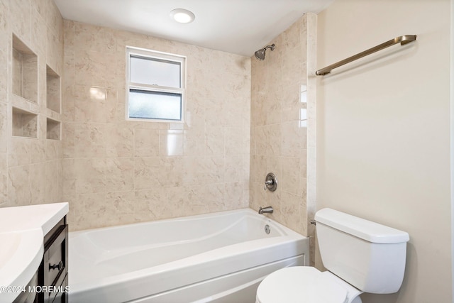 bathroom with toilet, vanity, and bathing tub / shower combination