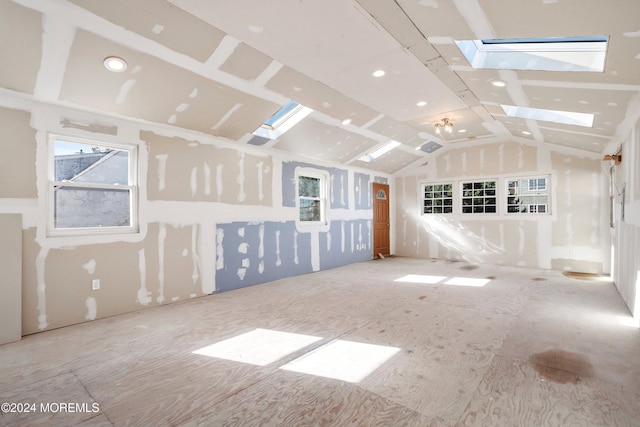 additional living space featuring lofted ceiling