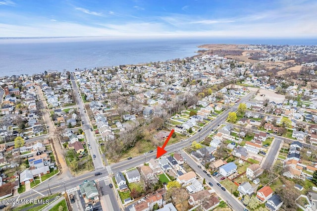 bird's eye view with a water view and a residential view