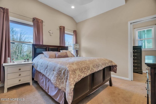 bedroom with lofted ceiling, recessed lighting, light colored carpet, and baseboards