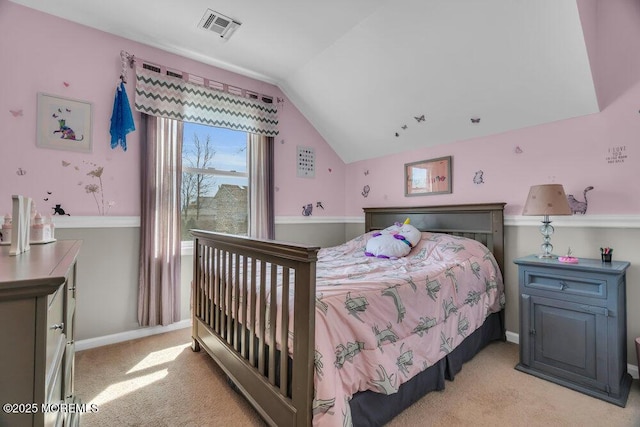 bedroom with lofted ceiling, light carpet, visible vents, and baseboards