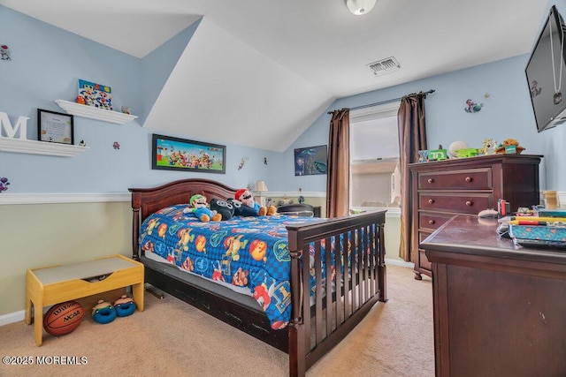 bedroom with baseboards, visible vents, vaulted ceiling, and light colored carpet