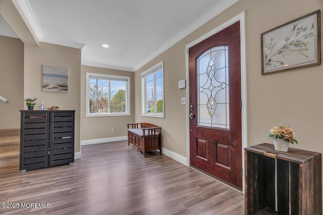 foyer with recessed lighting, baseboards, crown molding, and wood finished floors