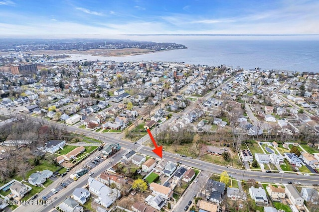 birds eye view of property featuring a water view and a residential view