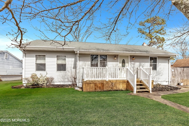 ranch-style home with a front lawn