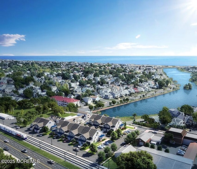 birds eye view of property featuring a water view and a residential view