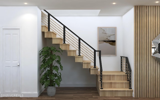 stairs with baseboards, wood finished floors, and recessed lighting