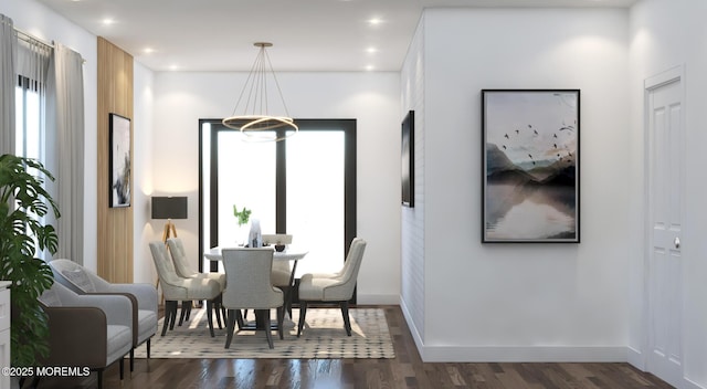 dining area with dark wood-style floors, recessed lighting, baseboards, and an inviting chandelier