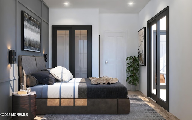 bedroom with french doors and multiple windows