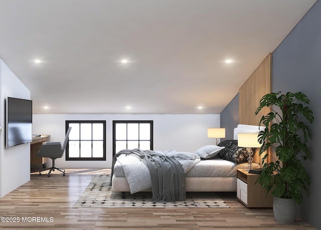 bedroom featuring vaulted ceiling, light wood-style flooring, and recessed lighting