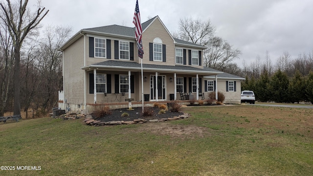 view of front facade featuring covered porch and a front yard