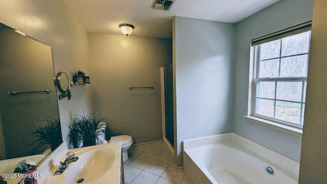 bathroom featuring visible vents, toilet, plenty of natural light, and tile patterned floors