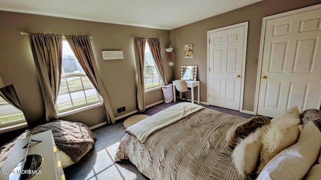 bedroom with baseboards and carpet floors
