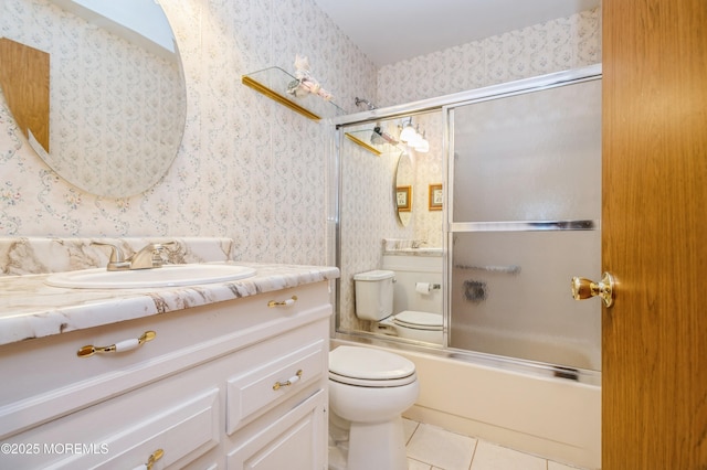 full bathroom featuring vanity, tile patterned floors, toilet, and wallpapered walls