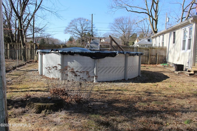 view of yard with a fenced backyard and a fenced in pool