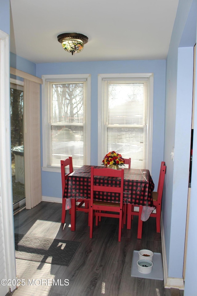 dining area featuring wood finished floors and baseboards