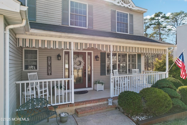 entrance to property featuring a porch