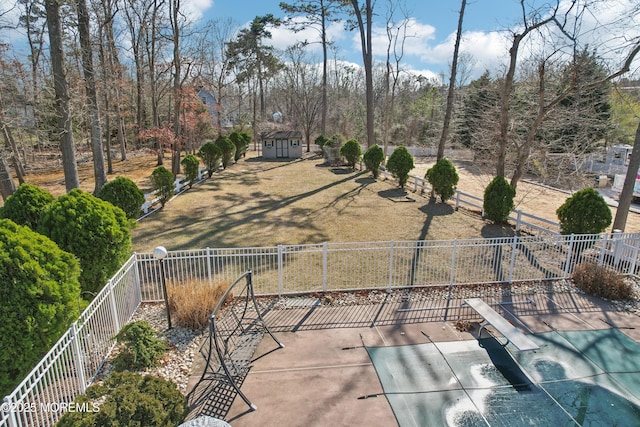 exterior space featuring an outdoor structure and fence