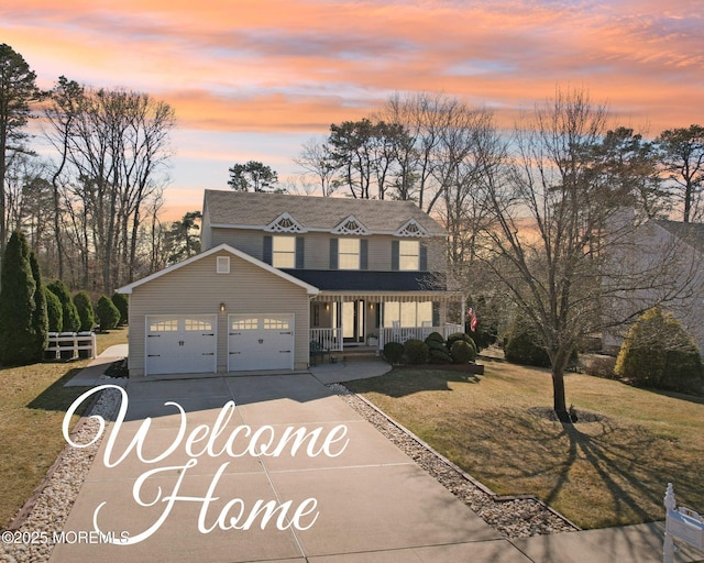 view of front facade featuring concrete driveway, a garage, a lawn, and covered porch