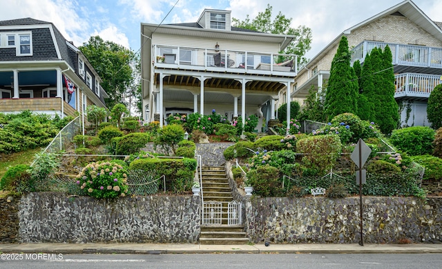 view of front of house with stairs