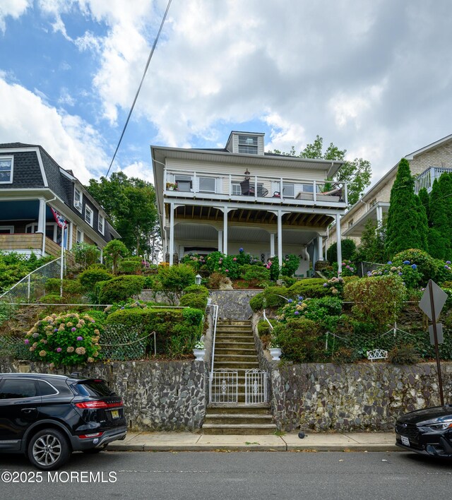 75 Highland Ave, Highlands, NJ 07732 - view of front facade with stairs and a balcony