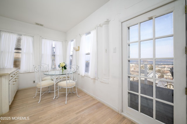 75 Highland Ave, Highlands, NJ 07732 - dining area featuring visible vents, baseboards, and light wood-style flooring