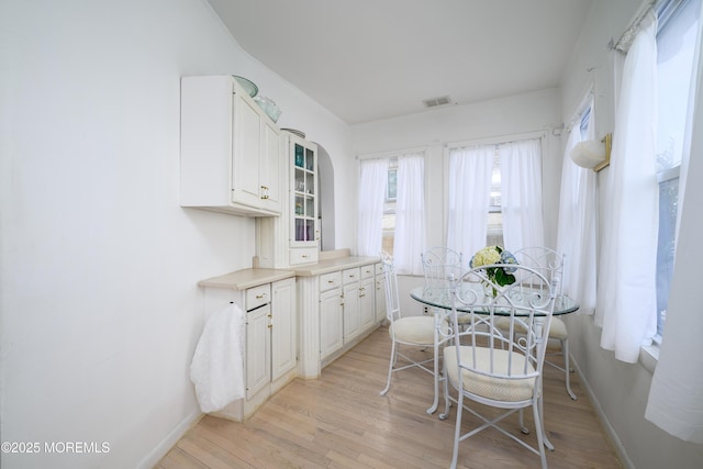 75 Highland Ave, Highlands, NJ 07732 - dining space with visible vents, baseboards, and light wood-style flooring