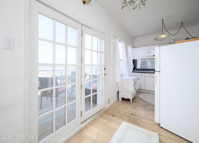 75 Highland Ave, Highlands, NJ 07732 - interior space featuring a notable chandelier and light wood-style flooring
