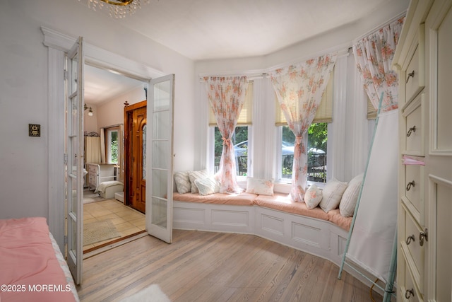 75 Highland Ave, Highlands, NJ 07732 - living area with french doors and light wood-style floors