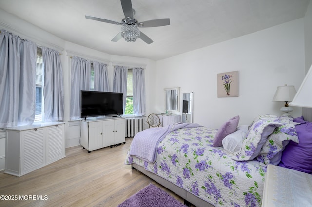 75 Highland Ave, Highlands, NJ 07732 - bedroom featuring light wood-style flooring, radiator heating unit, and ceiling fan