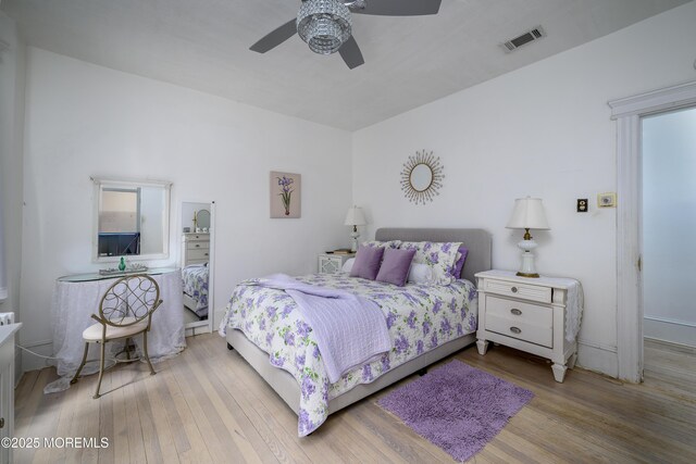 75 Highland Ave, Highlands, NJ 07732 - bedroom with ceiling fan, visible vents, and wood finished floors