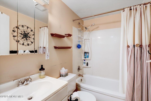 full bath with vanity, toilet, and shower / bath combo with shower curtain