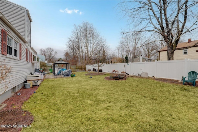 view of yard featuring a fenced backyard