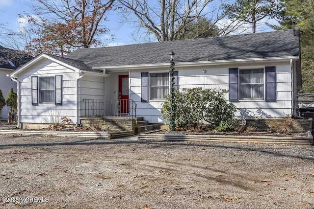 view of front of house with roof with shingles