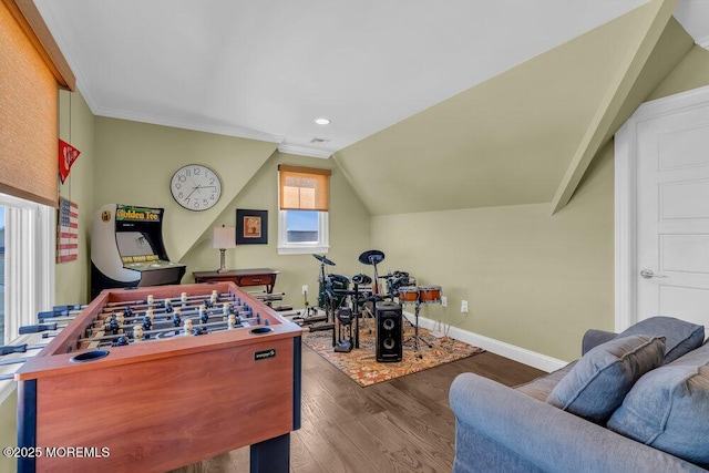 rec room with lofted ceiling, crown molding, wood finished floors, and baseboards