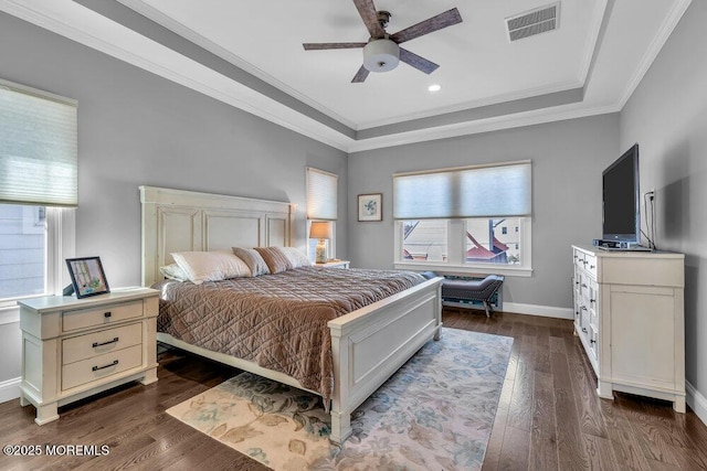 bedroom with dark wood-style floors, visible vents, baseboards, ceiling fan, and crown molding