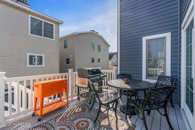 wooden deck featuring grilling area