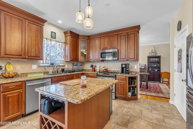 kitchen with a sink, appliances with stainless steel finishes, backsplash, brown cabinets, and open shelves