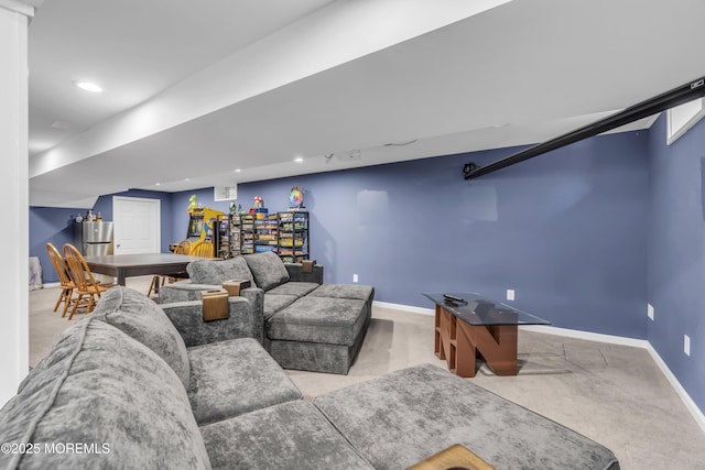 carpeted living room with recessed lighting and baseboards