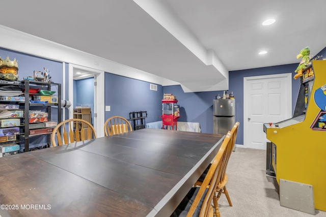 carpeted dining space featuring recessed lighting