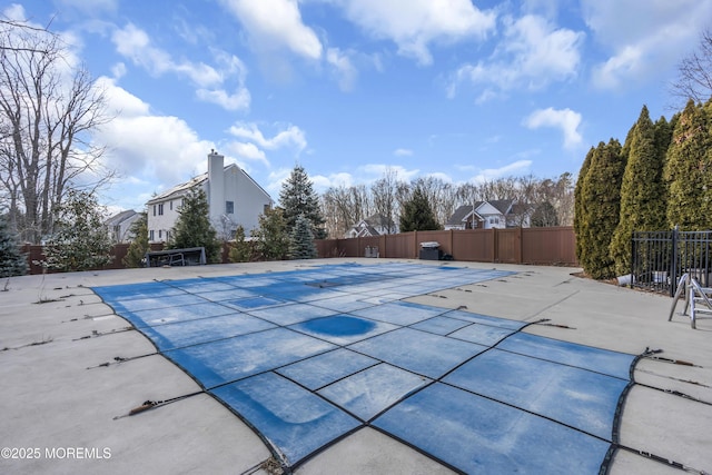 view of pool featuring a patio area, fence, and a fenced in pool