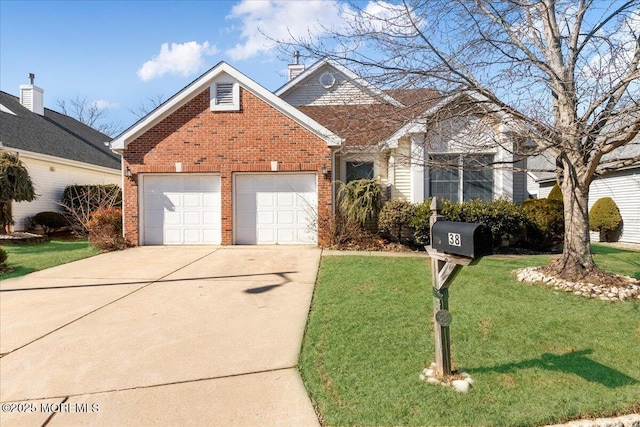 view of front facade with a garage, a front yard, concrete driveway, and brick siding