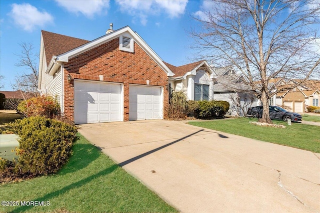 view of front of home featuring a garage, driveway, brick siding, and a front yard